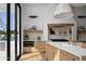 Bright modern kitchen featuring stainless appliances, light wood cabinets and access to the outdoors at 4120 N 44Th Pl, Phoenix, AZ 85018