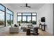 Bright living room featuring neutral furniture, wood floors, and large windows with neighborhood views at 4120 N 44Th Pl, Phoenix, AZ 85018