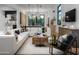 Open-concept living room features a large sectional, wood accents, and modern decor at 4120 N 44Th Pl, Phoenix, AZ 85018