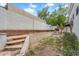 Large backyard shows ample gardening space and a concrete retaining wall at 4225 N 21St St # 22, Phoenix, AZ 85016