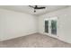 Spacious bedroom featuring neutral carpeting, a ceiling fan, and French door access at 4225 N 21St St # 22, Phoenix, AZ 85016