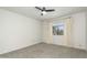 Bright bedroom featuring a window, a ceiling fan and carpet at 4225 N 21St St # 22, Phoenix, AZ 85016