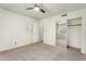 Bedroom with neutral carpet, ceiling fan, and mirrored closet doors at 4225 N 21St St # 22, Phoenix, AZ 85016