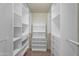 Walk-in closet with custom white shelving, drawers, and storage solutions at 4225 N 21St St # 22, Phoenix, AZ 85016