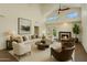 Bright living room with high ceilings, fireplace, neutral colors, and stylish furnishings for a comfortable and inviting space at 4225 N 21St St # 22, Phoenix, AZ 85016