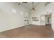 Large living space featuring natural light, French door access, and an open layout into the kitchen at 4225 N 21St St # 22, Phoenix, AZ 85016