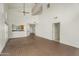 Open concept living area with brick floors, a ceiling fan and views into the kitchen area at 4225 N 21St St # 22, Phoenix, AZ 85016