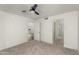 Bedroom featuring a ceiling fan, a doorway to the en suite bathroom, and neutral carpeting at 4225 N 21St St # 22, Phoenix, AZ 85016