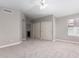 The bright bedroom features neutral paint, soft carpeting, a fan, and a dual door closet at 4714 E Angela Dr, Phoenix, AZ 85032