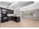 Open concept room featuring a modern kitchen with stainless steel appliances and light wood flooring at 4714 E Angela Dr, Phoenix, AZ 85032