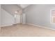 Bright living room with vaulted ceilings, light wood flooring, and ample natural light from a large window at 4714 E Angela Dr, Phoenix, AZ 85032