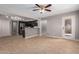 Open concept room showcasing a kitchen with stainless steel appliances and light wood flooring at 4714 E Angela Dr, Phoenix, AZ 85032