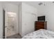 Cozy bedroom features a view to the ensuite bathroom and closet space at 5383 N 205Th Dr, Buckeye, AZ 85396