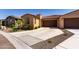 Beautiful home featuring desert landscaping, ample parking, and a spacious two-car garage at 5383 N 205Th Dr, Buckeye, AZ 85396