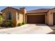 Charming single-story home featuring mature desert landscaping and a two-car garage at 5383 N 205Th Dr, Buckeye, AZ 85396