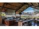 This well-appointed outdoor kitchen has mountain views, high end appliances, and plenty of seating at 5383 N 205Th Dr, Buckeye, AZ 85396