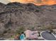 Aerial shot of a home and backyard pool surrounded by arid desert and a mountain backdrop at 5829 W Alyssa Ln, Phoenix, AZ 85083