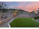 Beautiful backyard featuring green grass, gravel detail and amazing views of the mountain in the distance at 5829 W Alyssa Ln, Phoenix, AZ 85083