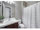 Standard bathroom with a white shower curtain, tile countertops, and a vanity at 5829 W Alyssa Ln, Phoenix, AZ 85083