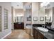 A spacious bathroom features dual vanities, a soaking tub, and travertine flooring at 5829 W Alyssa Ln, Phoenix, AZ 85083