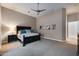 Relaxing bedroom with neutral colors, a ceiling fan, and artwork on the walls at 5829 W Alyssa Ln, Phoenix, AZ 85083