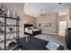 Bedroom area features a black bed frame, desk, bookshelf, and neutral paint colors at 5829 W Alyssa Ln, Phoenix, AZ 85083