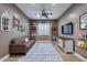 Inviting bonus room with a comfortable couch, playful decor, and hardwood floors at 5829 W Alyssa Ln, Phoenix, AZ 85083