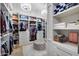 Organized walk-in closet featuring custom shelving, ample storage, and chandelier lighting at 5829 W Alyssa Ln, Phoenix, AZ 85083