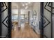 Elegant foyer with wood floors and modern light fixtures at 5829 W Alyssa Ln, Phoenix, AZ 85083