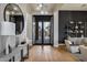 Grand foyer with stylish decor, wood floors, and decorative doors at 5829 W Alyssa Ln, Phoenix, AZ 85083