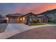 Beautiful single-story home featuring a two-car garage, stone accents and desert landscaping at 5829 W Alyssa Ln, Phoenix, AZ 85083