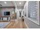 Inviting hallway with wood floors, large windows, and comfortable bench at 5829 W Alyssa Ln, Phoenix, AZ 85083