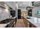 Gourmet kitchen boasts a professional range, custom cabinets, a large island, and sleek stainless steel appliances at 5829 W Alyssa Ln, Phoenix, AZ 85083