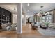 Expansive living space with hardwood floors, modern furnishings, and stylish lighting at 5829 W Alyssa Ln, Phoenix, AZ 85083