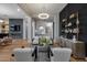 Bright living room with modern furnishings, decorative shelving, and beautiful lighting at 5829 W Alyssa Ln, Phoenix, AZ 85083