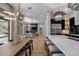 Bright, open-concept living space flows into a modern kitchen with a large island and stainless steel appliances at 5829 W Alyssa Ln, Phoenix, AZ 85083