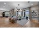Bright living area with oversized windows, comfortable seating, and pool views at 5829 W Alyssa Ln, Phoenix, AZ 85083