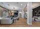 Spacious living room features hardwood floors, modern lighting, and ample seating at 5829 W Alyssa Ln, Phoenix, AZ 85083