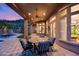 Covered patio features an outdoor dining area and stunning views at 5829 W Alyssa Ln, Phoenix, AZ 85083