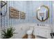 Stylish powder room with blue wallpaper, white vanity, and gold accents at 5829 W Alyssa Ln, Phoenix, AZ 85083