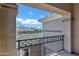 Balcony with wrought iron railing and views of the rooftops and neighborhood at 60 W Tonto Dr, Chandler, AZ 85248