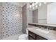 Beautiful bathroom featuring decorative tile walls, granite counters and modern fixtures at 60 W Tonto Dr, Chandler, AZ 85248