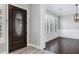 Elegant foyer featuring a decorative front door and views of the dining room, which has a large window at 60 W Tonto Dr, Chandler, AZ 85248