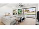 Bright living room with a large sliding glass door leading to the pool area and modern furniture at 6116 E Charter Oak Rd, Scottsdale, AZ 85254