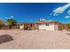 Backyard featuring rock landscaping with a covered patio at 6305 E Adobe Rd, Mesa, AZ 85205
