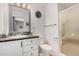 Clean bathroom featuring a single sink, shower, toilet, and decorative backsplash at 6305 E Adobe Rd, Mesa, AZ 85205