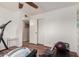 Bedroom includes exercise equipment, closet and storage space, and bright natural light at 6305 E Adobe Rd, Mesa, AZ 85205