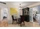Bright dining area features tile floors, a glass table with seating for four, and sliding glass door at 6305 E Adobe Rd, Mesa, AZ 85205
