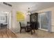 Bright dining area features tile floors, a glass table with seating for four, and sliding glass door at 6305 E Adobe Rd, Mesa, AZ 85205