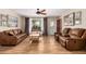 Spacious living room features wood floors and a red front door at 6305 E Adobe Rd, Mesa, AZ 85205